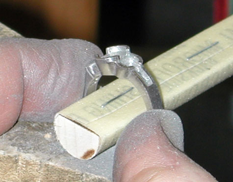 Close-up image of a platinum ring being refinished using this micro-finishing film