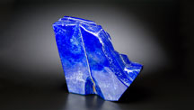 Lapis – an aggregate of several minerals, mainly lazurite, calcite and pyrite – is often found in large sizes, such as this 22-inch tall free-form piece from Afghanistan. Photo by Kevin Schumacher/GIA