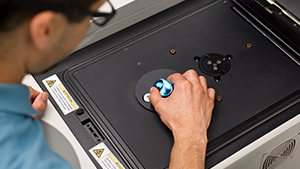 Researcher using a XRF spectrometer.
