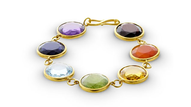 An 18K yellow gold “Gold Rush” bracelet features garnet, carnelian, citrine, tourmaline, blue topaz, iolite and amethyst. Photo by Sandra Stampfli, courtesy Bahina Jewels