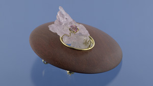 「サークル内の空虚感」と名付けられたこの魅力的な作品は、シェル・シルバースタイン著の子供向けの本「行方不明の作品」（"The Missing Piece"）からインスピレーションを得ました。木、ローズクォーツ、インペリアルトパーズ、18カラットのゴールドが特徴です。 これはペンダントとかブローチとして着用できます。 - 写真：ドン・メンガソン、 © GIA、マリア・ルシア・バーボサの寄贈。