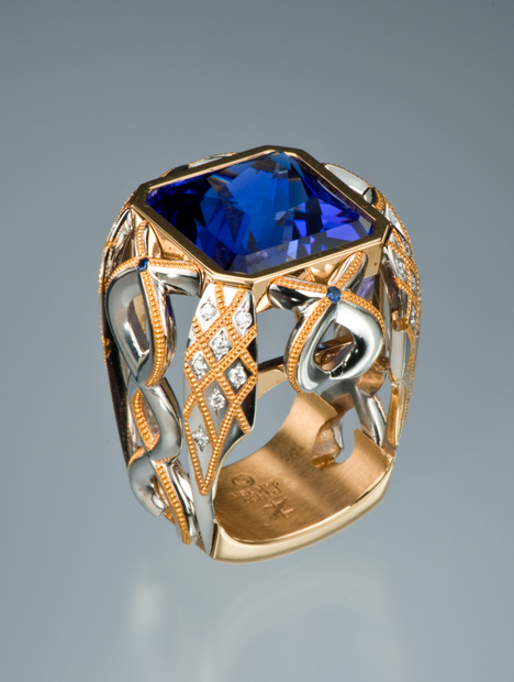 Intricate princess cut blue Tanzanite ring set in platinum inlay with gold accents