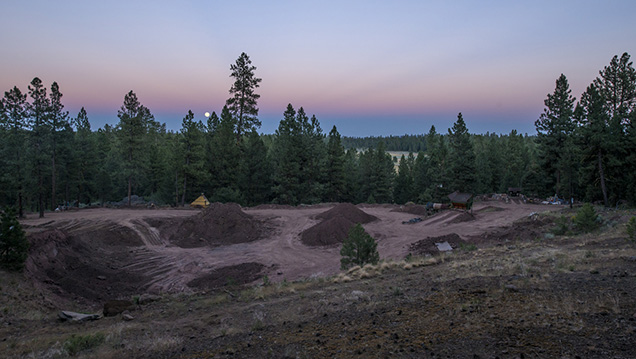 The red rocks of the Ponderosa mine’s pit complement the setting sun. - Robert Weldon