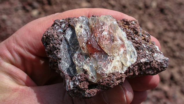 We recovered this nice specimen of zoned sunstone crystal in host basalt after it passed through the wet trommel. You can see that the crystal was originally considerably larger. - Duncan Pay