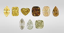 Figure 1. Yellow is the most common color in 480 nm band diamonds and can occur in different tones and saturations (top row, three on the left). The 480 nm band diamond family also includes those with brown and orange colors (top row, three on the right), as well as chameleon diamonds with a green color component (bottom row). Photos by GIA staff.