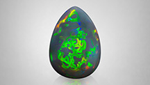 Figure 1. A natural 47.77 ct Ethiopian opal with an unusual play-of-color pattern. Photo by Nuttapol Kitdee.