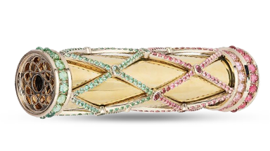Lattice-patterned gems encase an 18K gold kaleidoscope. 
