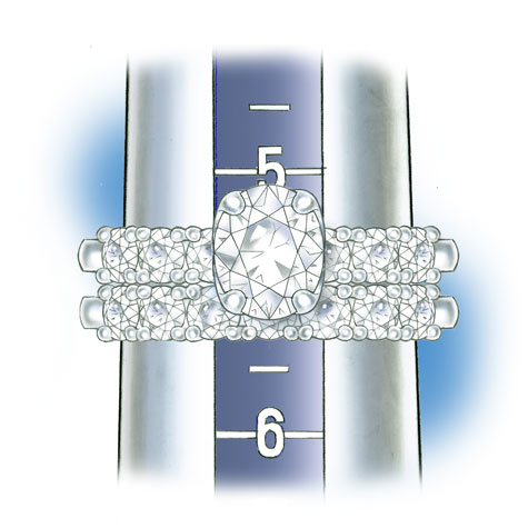 Close-up view of wedding set positioned on plastic ring mandrel to check ring size. 