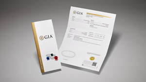 GIA Pearl Classification Report with main components of the report on display, and colored stones and pearls on the front cover.