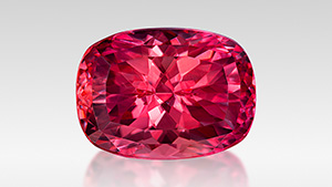 Figure 1. Ben Kho fashioned this 12.88 ct Portuguese cushion-cut rhodochrosite from Colorado’s Sweet Home mine to win both the 2024 AGTA Cutting Edge Buyer’s Choice Award and second place in the North American Gemstones category. Photo by Jeff Mason Photography; courtesy of Ben Kho.
