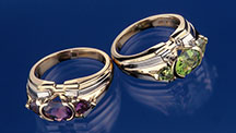 “Healing Sisters” rings featuring amethyst and peridot.