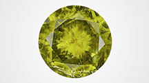 Figure 1. The face-up view of a 2.32 ct faceted pallasitic peridot, the largest extraterrestrial peridot seen at GIA to date. Photo by Diego Sanchez.