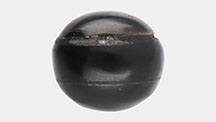Figure 1. An assembled black non-nacreous imitation pearl weighing 10.56 ct and measuring 12.23 × 11.87 × 10.78 mm. Photo by Gaurav Bera.
