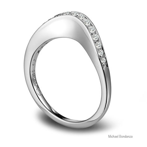 Side view of platinum band designed by Michael Bondanza, featuring diamonds channel-set into a curved top.